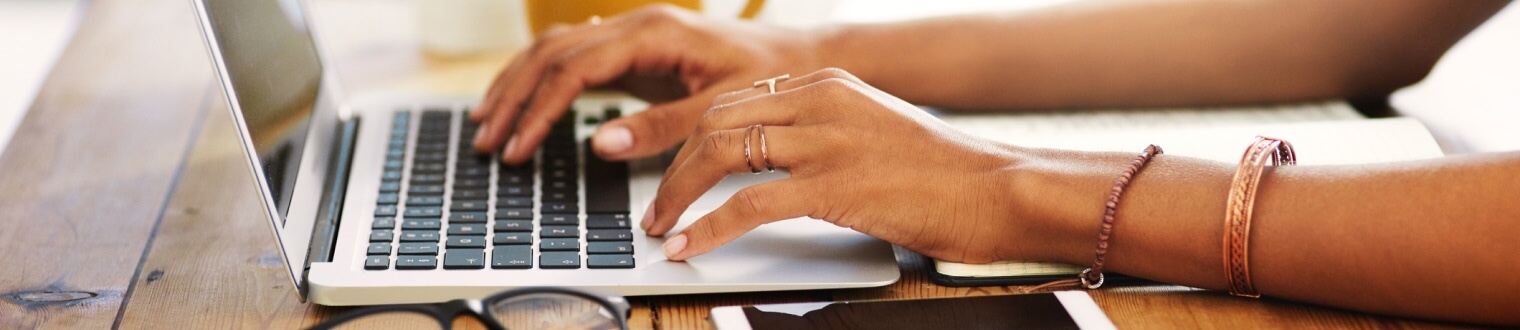 Person typing on laptop